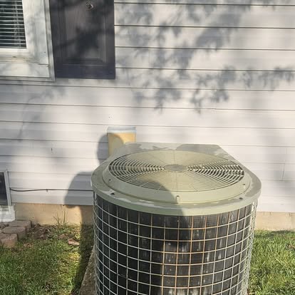 A newly installed outdoor air-conditioning condenser